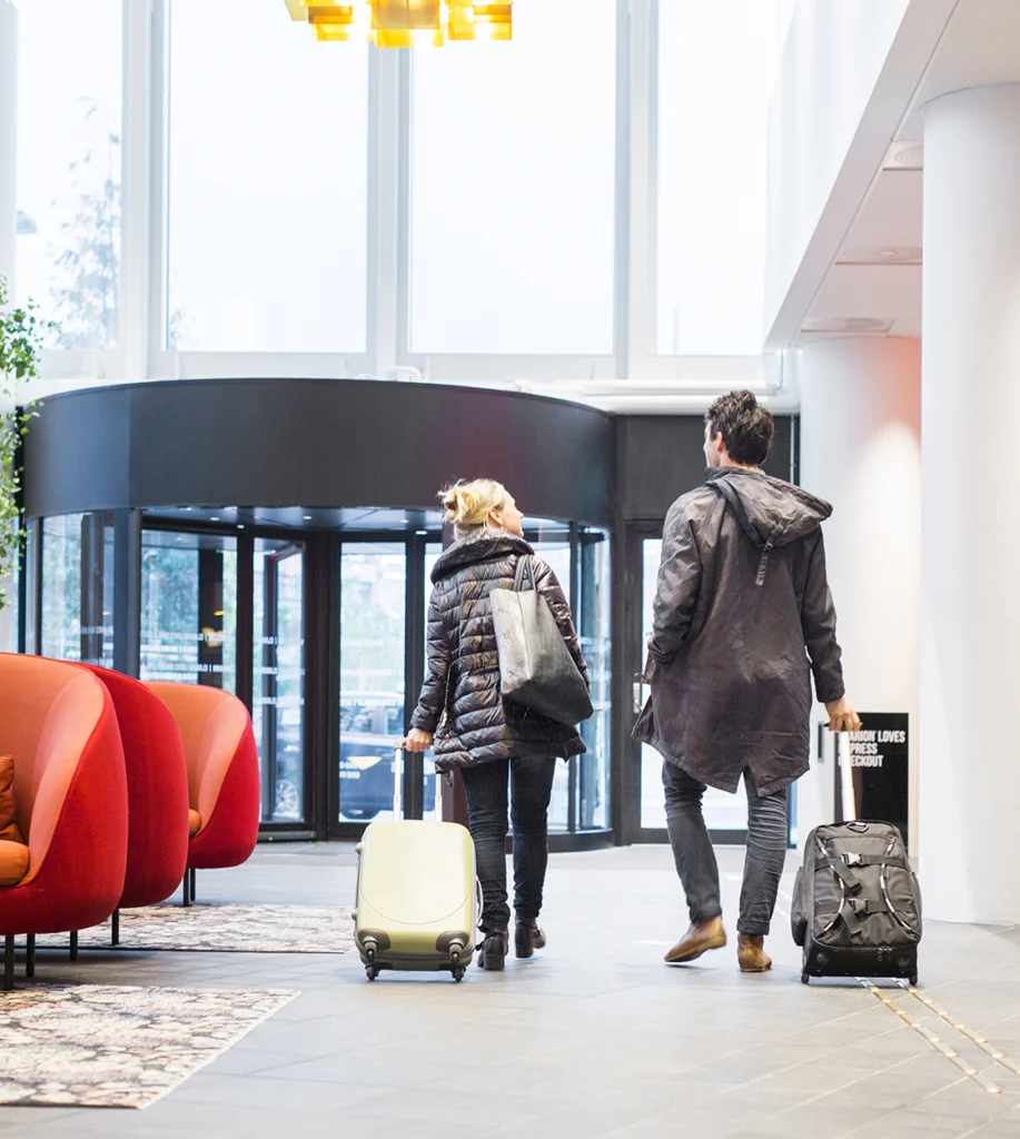 Travelers with luggage walking